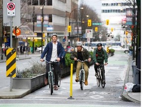 Cyclists use a bike lane on Hornby Street in downtown Vancouver.