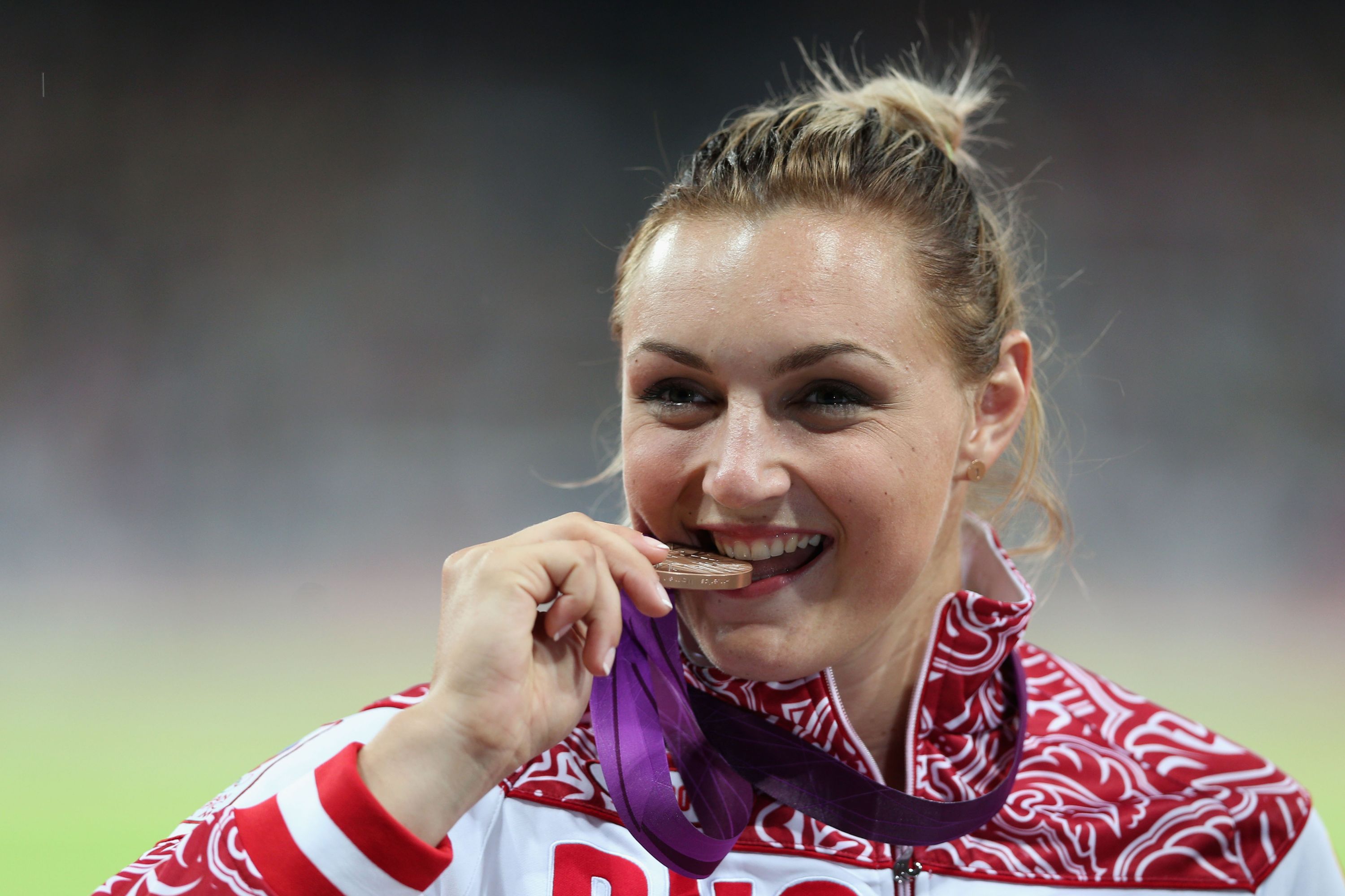 LONDON, ENGLAND - AUGUST 06:  Bronze medalist Evgeniia Kolodko of Russia poses on the podium during the medal ceremony for the Women's Shot Put final on Day 10 of the London 2012 Olympic Games at the Olympic Stadium on August 6, 2012 in London, England.  (Photo by Clive Brunskill/Getty Images)