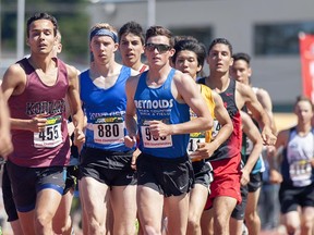 Reynolds Secondary senior Brendan Hoff (sunglasses, front right) helps set the pace in front of the pack with Josh Kozelj (455) of Heritage Woods and Point Grey’s Thomas Nobbs (880) of during 3,000-metre final at the B.C. high school track and field championships Saturday in Nanaimo.