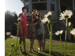 Mary-Ellen Turpel-Lafond, with her kids from left, Isobel,14, Isaiah, 12, and Portia, 14, at home in Victoria this week. She always asks for "world peace" for Mother's Day, but her kids say they can't deliver it. She tells them to do what they can.
