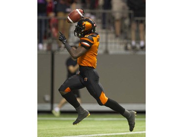 VANCOUVER June 25 2016.  BC Lions #2 Chris Rainey runs a kicked ball back for a touchdown against the Calgary Stampeders in a regular season CFL football game at BC Place, Vancouver June 25 2016. ( Gerry Kahrmann  /  PNG staff photo)   ( For Prov / Sun Sports )  20043919A [PNG Merlin Archive]