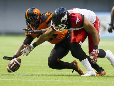 BC Lions #21 Ryan Phillips keeps Calgary Stampeders #1 Lemar Durant from making a catch in a regular season CFL football game at BC Place, Vancouver June 25 2016.