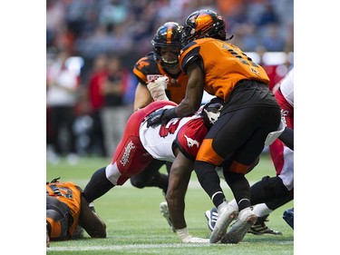 BC Lions #11 Mike Edem stops a drive by Calgary Stampeders #33 Jerome Messam on the goal line in a regular season CFL football game at BC Place, Vancouver June 25 2016.