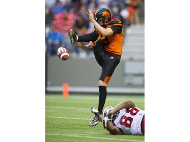 BC Lions #3 Richie Leone kick is blocked watched by Calgary Stampeders #88 Kamar Jorden in a regular season CFL football game at BC Place, Vancouver June 25 2016.