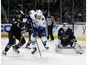 Playing at the NHL level, Emerson Etem (centre, being stopped by San Jose's Martin Jones) has seen his production wane. But he's determined to make his mark this season on a one-year deal.