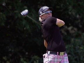 Alena Sharp watchers her tee shot on the eighth hole during the third round of the Meijer LPGA Classic on June 18, 2016 at Blythefield Country Club in Belmont, Michigan.