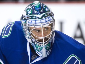 Vancouver Canucks' goalie Ryan Miller follows the play during the first period of an NHL hockey game against the Los Angeles Kings in Vancouver, B.C., on Monday April 4, 2016.