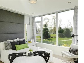 In this show suite bedroom, a horizontal wood design covers an entire wall, meeting the window drapery’s vertical lines in the corner, a complement of opposites.