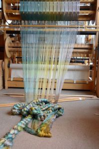 Winding the warp onto the loom | Silk Weaving Studio