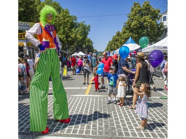 Bubbles the Clown gets a wave at Greek Day on West Broadway in Vancouver, B.C., June 26, 2016.