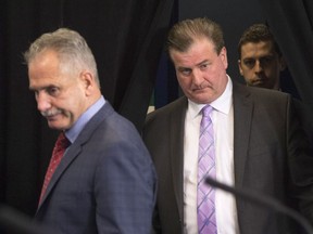 Vancouver Canucks general manager Jim Benning, right, and head coach Willie Desjardins