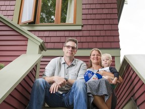 VANCOUVER,BC:JUNE 20, 2016 -- James, Jennifer and Milo Silver site on the front steps of their home in Vancouver, BC, June, 20, 2016.  They renovated the former grow op and had tons of difficulty selling it due to the reluctance of banks to finance such homes. (Richard Lam/PNG) (For Matt Robinson) 00043815A *****FOR USE WITH THIS STORY ONLY***** [PNG Merlin Archive]