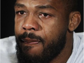Mixed martial arts fighter Jon Jones cries as he speaks during a news conference on Thursday in Las Vegas. Jones was scheduled to fight Daniel Cormier at UFC 200 but was pulled from the event because of a potential violation of the UFC's anti-doping policy.