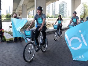 Vancouver's Mobi bike-share system made its soft launch July 20. Mayor Gregor Robertson cycles through a banner to kick off the launch. Vision's 'green ways' should be taken with grain of salt, writes Gordon Clark. Michael Mui/24 hours files