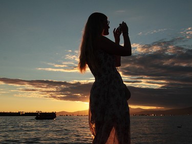 Karen Woodford captured the sunset and the crowd while waiting for the start of The Celebration of Light.  Rob Kruyt Photo