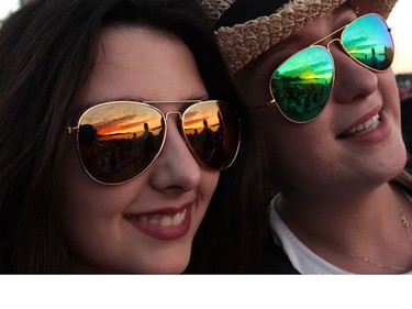 Didem Gulsay (left) and Ceren Atahon watch the sunset flickering into the ocean while waiting for the start of the Celebration of Light.  Rob Kruyt Photo