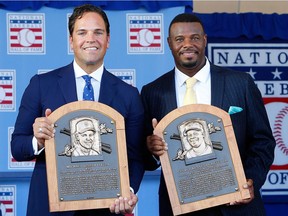 COOPERSTOWN, NY - JULY 24:  Mike Piazza (L) and Ken Griffey Jr. pose with thier plaques at Clark Sports Center after the Baseball Hall of Fame induction ceremony on July 24, 2016 in Cooperstown, New York.