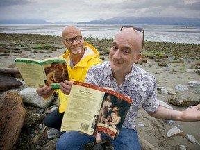 Christopher (Toph) Marshall, a U.B.C. 
professor with some special historical books for beach reading,  sharing his colourful finds with the Province's Wayne Moriarty, left, on Vancouver's Spanish Banks.