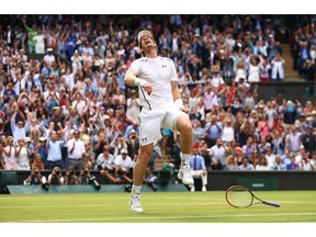 Andy Murray of Great Britain celebrates his 6-4, 7-6 (3), 7-6 (2) victory over Canadian Milos Raonic for the Wimbledon mens' singles championship.