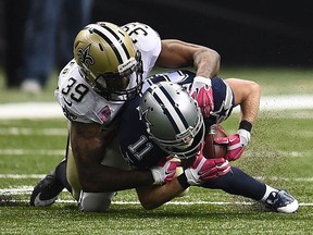 Brandon Browner, pictured tackling Dallas's Cole Beasley in a 2015 game, is facing an investigation into allegedly hitting his girlfriend's father. He is back with the Seattle Seahawks for the upcoming 2016 season.