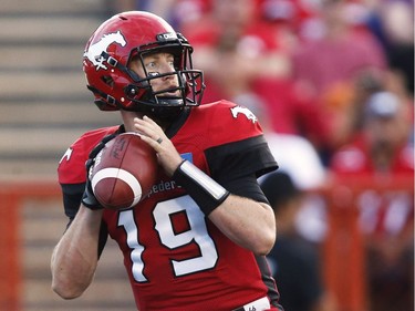 Calgary Stampeders quarterback Bo Levi Mitchell looks to pass against the BC Lions during first half CFL football action in Calgary, Friday, July 29, 2016.