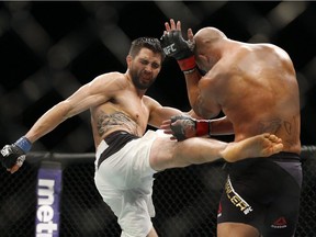 Carlos Condit kicks Robbie Lawler during a welterweight championship mixed martial arts bout at UFC 195, Saturday, Jan. 2, 2016, in Las Vegas. The welterweight bout between Demian Maia and Carlos (The Natural Born Killer) Condit has been shifted from UFC 202 to the main event of the UFC show in Vancouver on Aug. 27.