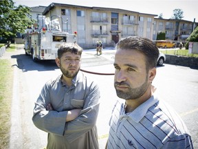 Bilal Al Falovji, left, and Mohammad Alradi are among about 50 Syrian refugees left homeless after an apartment fire Thursday in the 500 block Cottonwood Avenue in Coquitlam. Mark van Manen/PNG