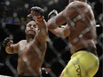 Daniel Cormier, left, fights Anderson Silva during their light heavyweight mixed martial arts bout at UFC 200, Saturday, July 9, 2016, in Las Vegas.