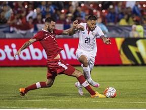 David Edgar, left, playing for Canada, is expected to make his Whitecaps debut Tuesday in a friendly against English Premier League team Crystal Palace.