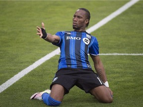 FILE - Montreal Impact's Didier Drogba celebrates after scoring against Philadelphia Union during first half MLS soccer action in Montreal in a May 14, 2016, file photo. Winless in their last six games, the Montreal Impact will get a boost Saturday with the return of star forward Didier Drogba.