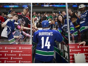 Alex Burrows walks off the ice after a game against the Oilers.