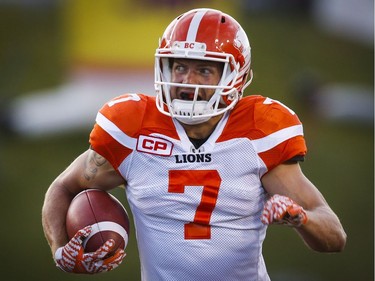 BC Lions' Eric Fraser runs in an interception for a touchdown against the Calgary Stampeders during first half CFL football action in Calgary, Friday, July 29, 2016.