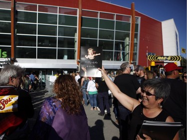 Fans gather to see Gord Downie, and the first stop of the Tragically Hip's Man Machine Poem Tour outside the Save-On-Foods Memorial Centre in Victoria on Friday.