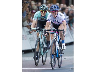 Tina Pic, ( R ), the oldest rider in the race at age 50, beats Kimberly Wells (L )to win the pro women's race at the Gastown Grand Prix Vancouver, July 13 2016.