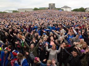 Icelandic soccer fans celebrate as they watch the Euro 2016 round of 16 match between Iceland and England shown on a screen in Reykjavik, Iceland, last week. It was reported that 99.8 per cent of the country's population watched the game.