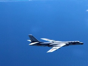 A Chinese H-6K bomber patrols islands and reefs in the South China Sea.