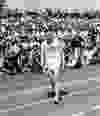 Jim Peters races in the marathon at the British Empire Games on August 7, 1954.