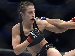 Joanna Jedrzejczyk, left, competes against Valerie Letourneau during their UFC 193 strawweight title fight in Melbourne, Australia, Sunday, Nov. 15, 2015.