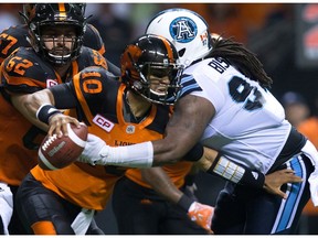 B.C. Lions quarterback Jonathon Jennings is sacked by Toronto Argonauts' Ken Bishop on Thursday.