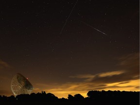 A Perseid meteor streaks across the sky over the Lovell Radio Telescope at Jodrell Bank in England in August 2013. Astronomers expect 2016 to be a very good year for Perseid meteor sightings.