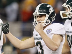 In this 2015 file photo, Michigan State holder Mike Sadler (3) celebrates after kicker Michael Geiger booted the game-winning point in the Cotton Bowl against Baylor in Arlington, Texas. Sadler and Nebraska punter Sam Foltz died in a car crash in Wisconsin after working at a kicking clinic, a sheriff's department official said Sunday.