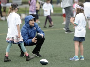 Jen Welter, the first female coach in the NFL takes part in the league's Play 60 program in Vancouver on July 7, 2016.