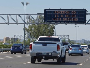 A freeway sign in Phoenix urges drivers to not play Pokemon Go behind the wheel. Police in Vancouver and Richmond have posted similar warnings ahead of the game's official release in Canada.