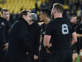 New Zealand head coach Steve Hansen talks with captain Kieran Read after the rugby Test match between the New Zealand All Blacks and Wales in Wellington on June 18, 2016.