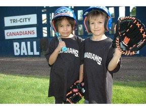 Showing off their new baseball gear at the Vancouver Canadians' mini baseball league are Georgina Mitchell and Jackson Brown. Thanks to the Boys and Girls Clubs of the South Coast and the C's, kids are having a ball this summer.