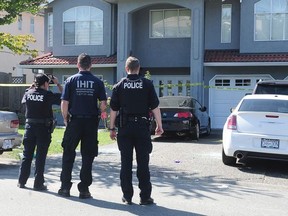 Integrated Homicide Investigation Team on there scene of a fatal shooting at 14302 90A Ave, in Surrey, BC., July 24, 2016.