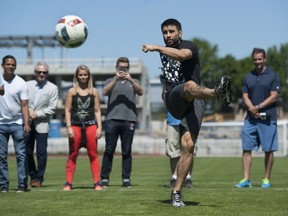 UFC fighter Carlos Condit practises with the Vancouver Whitecaps at UBC Thursday.