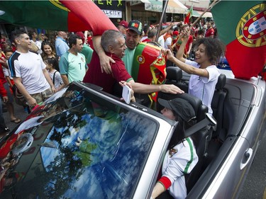 Vancouver   B.C.  July 10, 2016   Portuguese fans go wild on Vancouver's Commercial Drive as they celebrate Portugal beating  France to win Euro 2016 soccer tournament, which took place in France.   Mark van Manen/ PNG Staff photographer   see  Vancouver Sun/ Province Sports  /News Features and Web. stories   00043697A [PNG Merlin Archive]