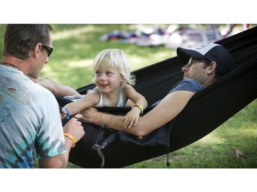 Vancouver   B.C.  July 17, 2016  Grooving to it all-- Thousands took part in the 39th annual Vancouver Folk Festival in Jericho Beach Park in Vancouver on July 17, 2016.  Musicians from around the world performed at the dynamic and colourful festival. Here hanging out with Dad,  2 year old London Cardinal has some fun.   Mark van Manen/ PNG Staff photographer   see  Franois Marchand Vancouver Sun/ Province   Entertainment  Features and Web. stories   00044092C [PNG Merlin Archive]