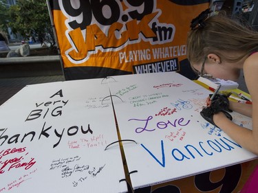Fans sign a card for Gord Downie before Sunday night's show at Rogers Arena.